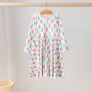 Organic cotton long-sleeve twirl dress for girls featuring colorful cowboy boot and star print, eco-friendly kids clothing.